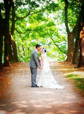 Bride and groom kissing on a path